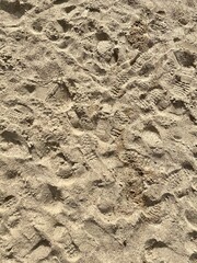 Footprints on a sand texture. Close up photo
