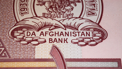 Closeup of Da Afghanistan Bank seal logo on afghan currency banknote from 70s