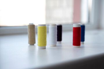 Spools of the colored thread	