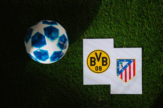 Atlético Madrid (ESP) vs Borussia Dortmund (GER). Quarter Finals of football UEFA Champions League 2024 in Europe. Logo of teams and official soccer ball on green grass