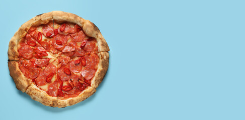 Delicious pepperoni pizza on light blue background with space for text, top view