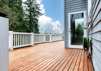 Freshly stain large home walk out cedar wood deck patio - 763539722