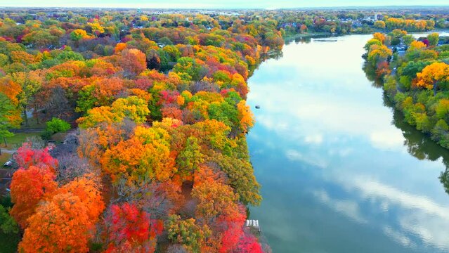 Northeastern Wisconsin's exceptional, breathtaking, Fall colors by the Fox River, aerial drone view from just above the treetops.