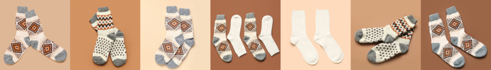 Set of different warm knitted socks on color background, top view