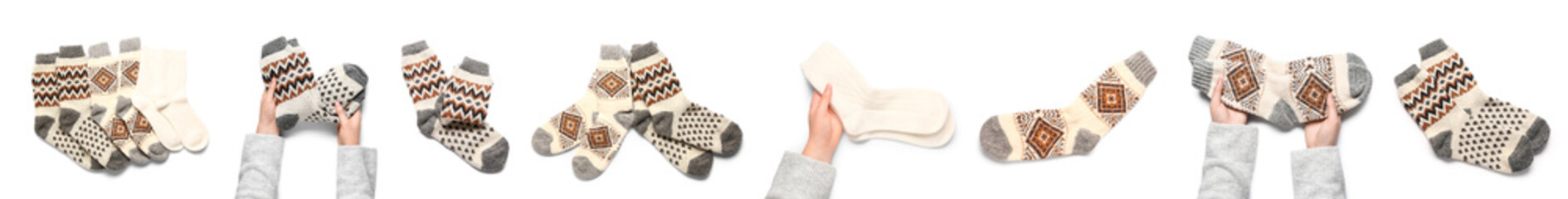 Set of different warm knitted socks on white background