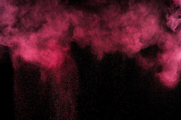 Fire texture. Smoke light. Red powder explosion on black background. Flame cloud. Pink dust...