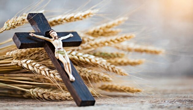 wooden crucifixion with bouquet of wheat and rye on light background with copy space religion background suitable for faith religion christian holidays easter redeemer the feast of corpus christi
