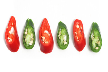 Close-up sliced red and green hot chili pepper top view isolated on white background clipping path - obrazy, fototapety, plakaty
