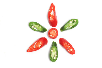 Sliced red and green hot chili pepper top view flower photo concept isolated on white background...