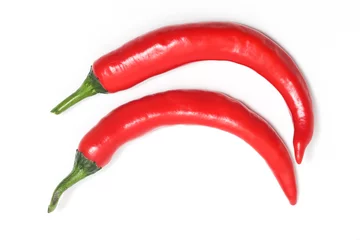 Keuken spatwand met foto Two red hot chili pepper top view isolated on white background clipping path © dwiangga
