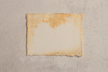 Beige and gold frame painting paper empty card blank on wood wall. Abstract texture copy space neutral grunge background.