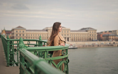 young woman on a bridge in Budapest - 763564533