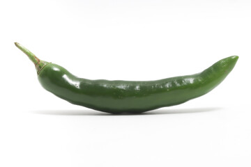 Green hot chili pepper side view isolated on white background clipping path