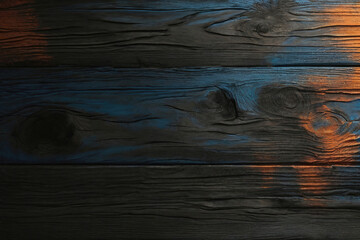 Black and Blue and Orange Dark Dirty wood wall wooden plank board texture background with grains...