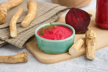 Foto op Plexiglas Horseradish sauce with beet in bowl and piece of beet on grey table © Pixel-Shot