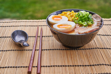 Delicious ramen soup from japan cuisine consist from noodles, pork belly, hard boiled egg, sweet...