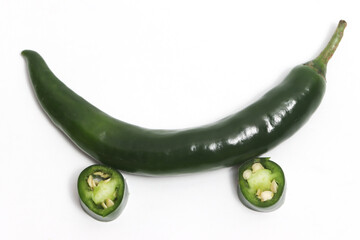 Sliced green hot chili pepper top view car photo concept isolated on white background clipping path