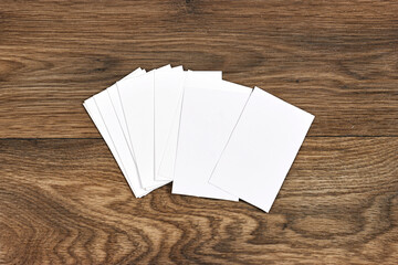 Corporate stationery set mockup at white textured paper background on wood table