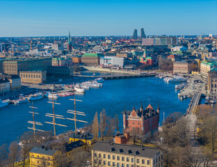 Fototapeta premium Stockholm old town - Gamla stan, Skeppsholmen, Ostermalm. Aerial view of Sweden capital. Drone top panorama photo