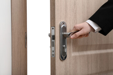 Male hand opening door on white background