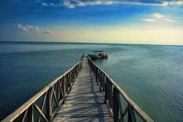 Foto auf Acrylglas Wooden pier on the sea in Mexico © Zsuzsanna