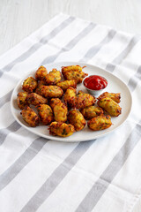 Homemade Fried Tater Tots on a Plate, side view.