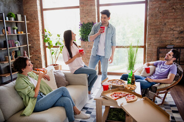 Photo of carefree best friends company sit chair couch chatting eat pizza delivery drink beer plastic cups flat indoors