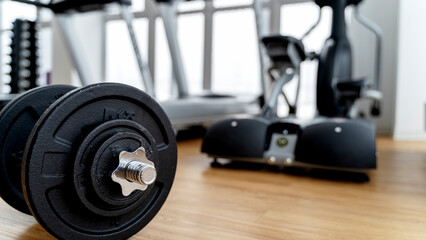 dumbbells and exercise equipment in the gym