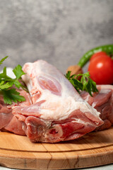 Veal shank. Raw beef shank on wood serving board. Close up