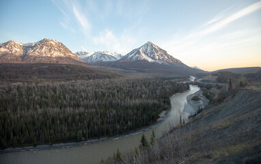 Late evening view of Matanuska River flowing  past Chugach Mountains near Palmer Alaska United...