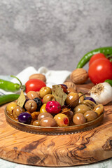 Mixed olives. Special mixed olives prepared with various olives on a wooden serving board