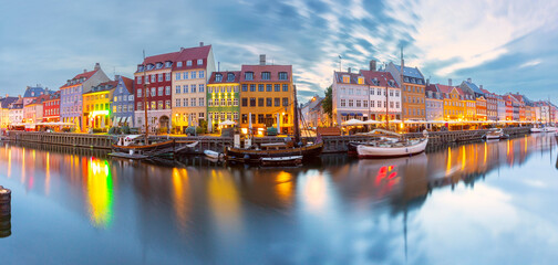 Panorama of Nyhavn with colorful facades of old houses and ships in Old Town of Copenhagen, Denmark. - 763587155