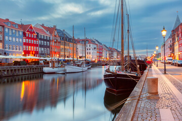Nyhavn with colorful facades of old houses and ships in Old Town of Copenhagen, Denmark. - 763587771