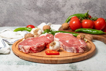 Beef entrecote. Raw beef ribeye on wood serving board