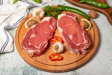 Beef entrecote. Raw beef ribeye on wood serving board