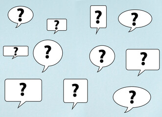 Speech bubbles with questions on blue background 