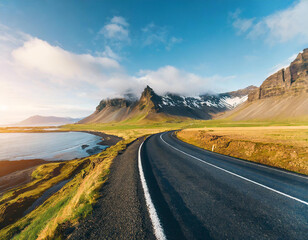 beautiful scenic road in Iceland, nature landscape aerial panorama, spectacular mountains and coast with sunset light