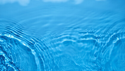 Blue Abstract background texture with water ripples and waves. Copy space. Top view flat lay