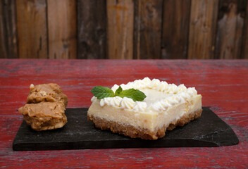 Sweet desserts. Closeup view of a portion of Key Lime Pie with caramel truffles.	