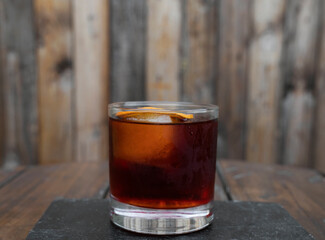 Cocktails. Closeup view of a Negroni alcoholic drink, with a dried orange slice.	
