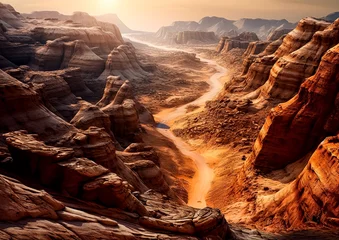 Fotobehang A desert landscape with a river running through it. The sun is setting, casting a warm glow over the scene. The rocks and sand create a sense of isolation and vastness © Людмила Мазур