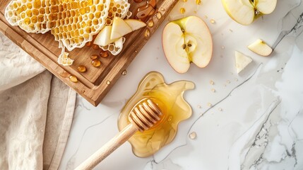 Top down flatlay spread, honey and sliced apples with fresh honeycomb on a wooden board and white countertop, Rosh Hashana spread
