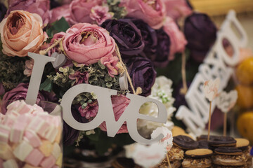 Decor wedding words Love and Me and you with Flower arrangement of different colors. Selective...