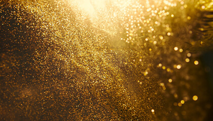 Fototapeta na wymiar Abstract elegant, detailed gold glitter particles flow with shallow depth of field underwater. Holiday magic shimmering luxury background. Festive sparkles and lights. de-focused.