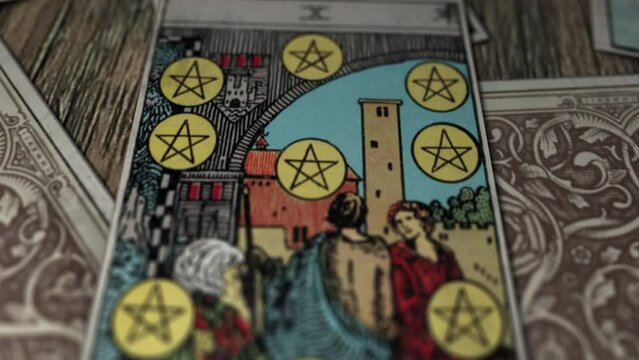Warsaw, Poland - June 01, 2015: Ten Of Pentacles Depicts Wise Old Man And Golden Coin Divination Signs. Golden Coin Divination Magic Card Foresees Wealth. Golden Coin Divination Mystical Connection