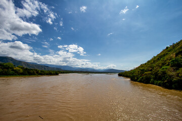 Cauca River with hills in the background in Santa Fe de Antioquia, Colombia
