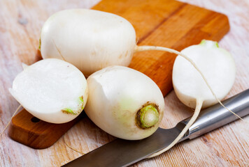 Many white radish on wooden surface. High quality photo