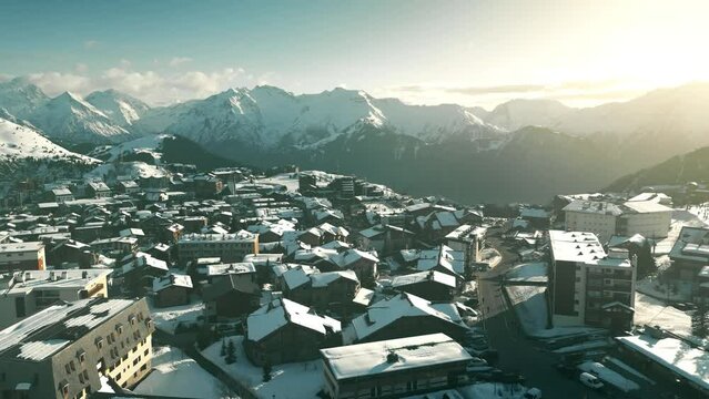 Aerial shot of hotels and chalets of Alpe d'Huez ski resort. Tourism in winter in France