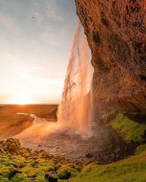 Seljalandsfoss waterfall at midnight sun, Southern Iceland, Iceland, Europe