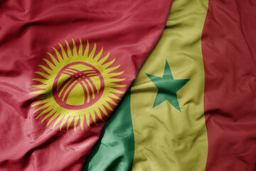 big waving national colorful flag of senegal and national flag of kyrgyzstan.